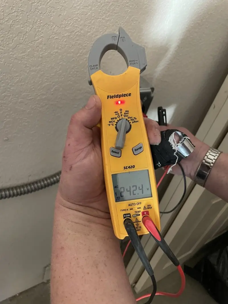Voltage testing with clamp meter during Electrical Installation Services in Melwood